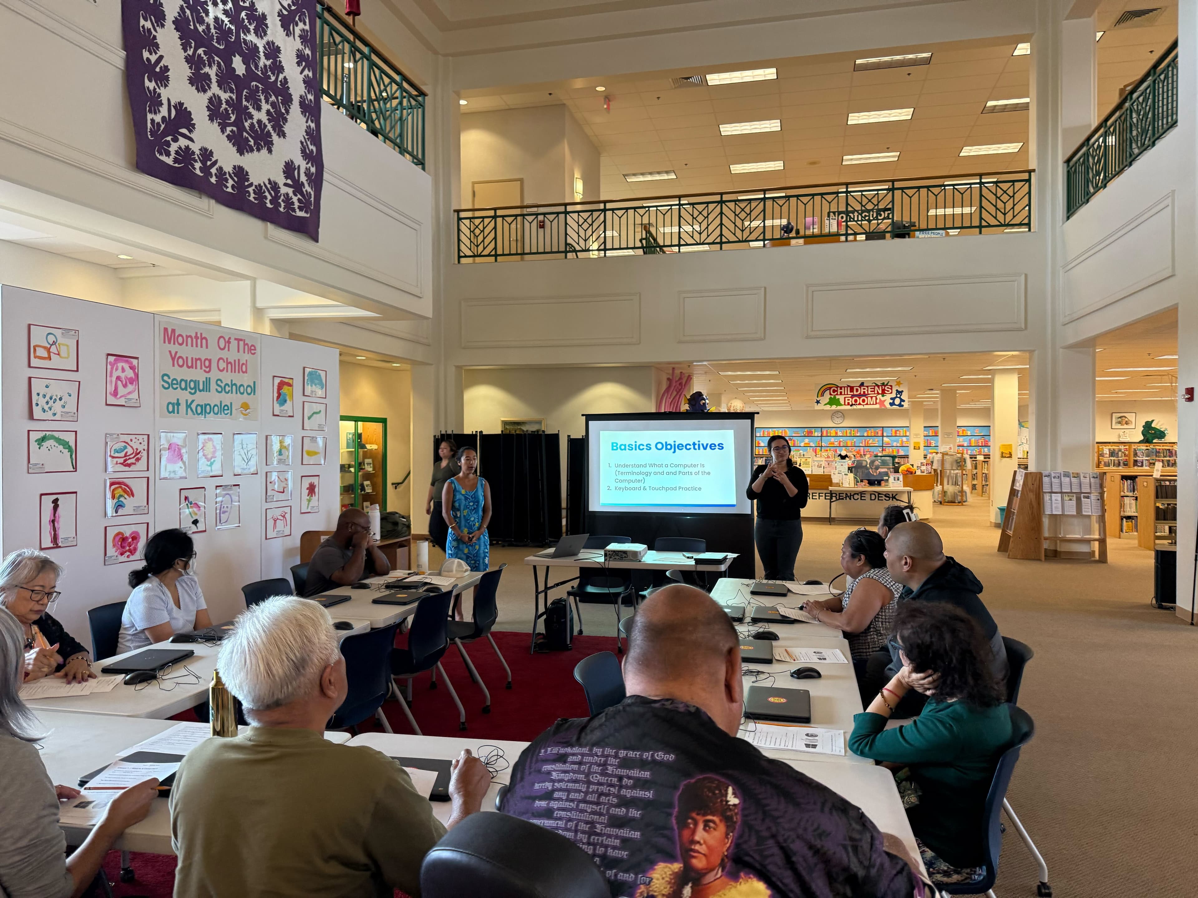Students learning computer skills in a classroom setting